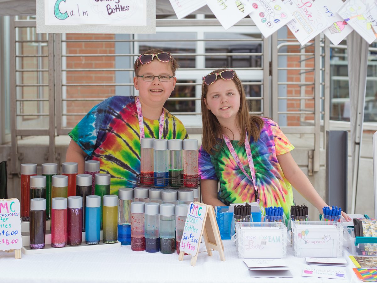 YEM students selling handmade goods at a market